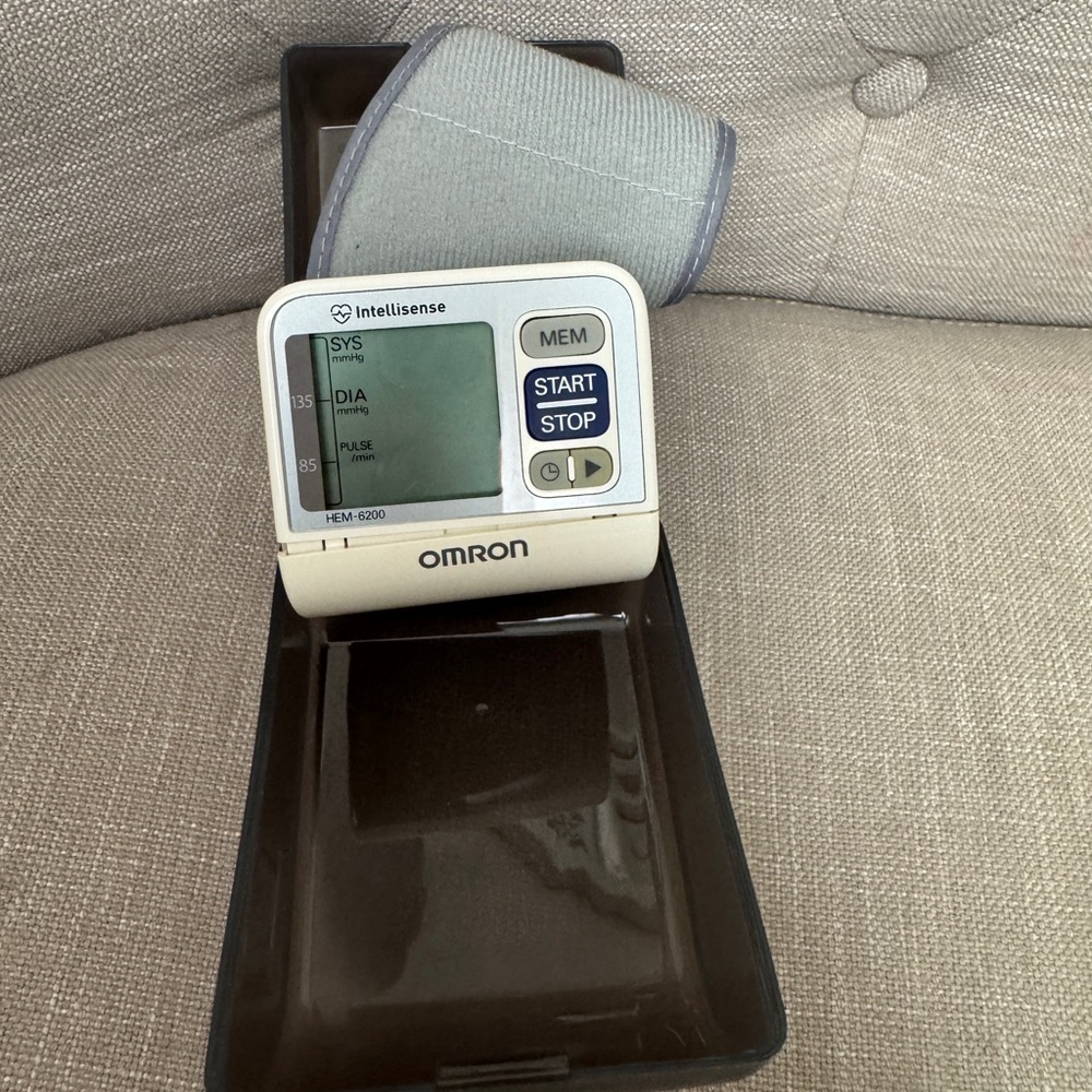 OMRON Wrist Blood Pressure Monitor in Light Gray and White